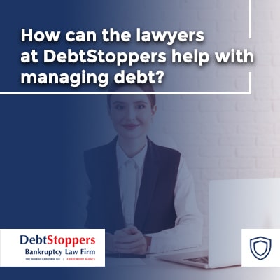 How can the lawyers at DebtStoppers help with managing debt?